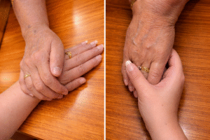 a panel of two images holding each other's hands